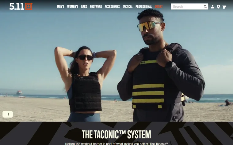 5.11 Tactical homepage: logo, product navigation and a large photo of two people wearing weighted training vests on a beach